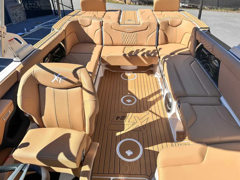 Slide: The Image of Interior of 2026 MasterCraft XT24 boat with luxurious leather seating. - 18