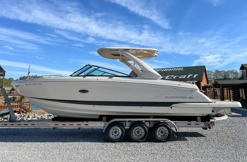 The Image of 2024 Chaparral 307 SSX boat on trailer, blue sky. - 1