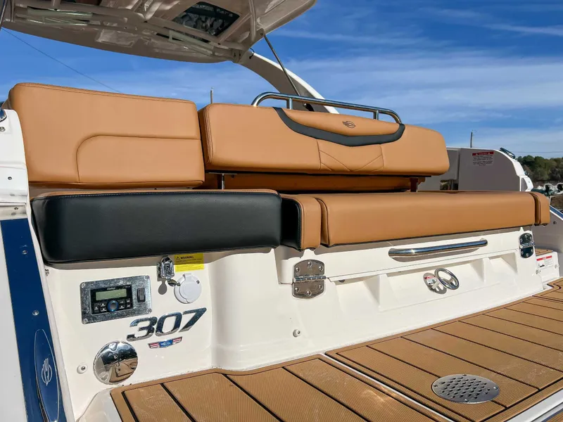 Slide: The Image of 2024 Chaparral 307 SSX boat rear seating and deck. - 14