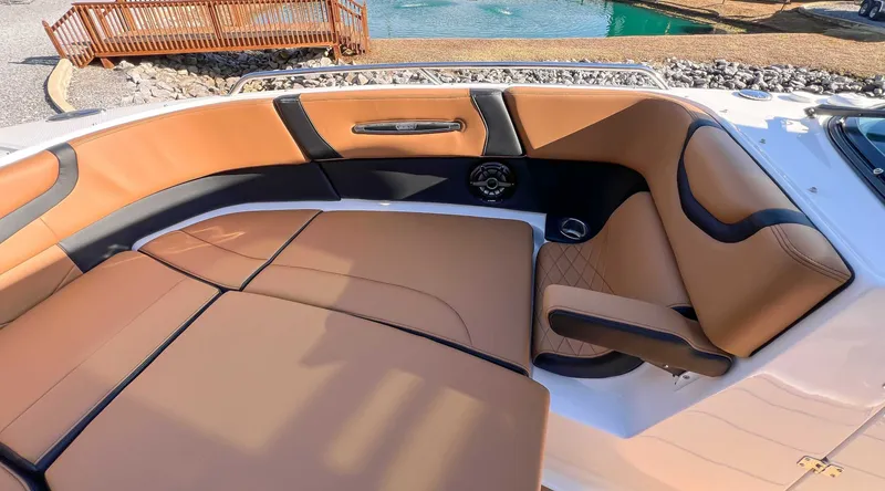Slide: The Image of Luxurious interior of 2024 Chaparral 307 SSX with brown leather seating. - 21
