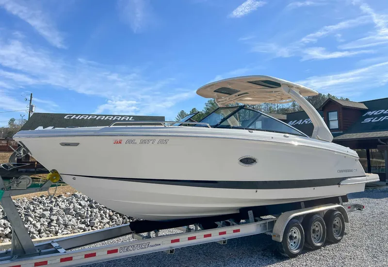 Slide: The Image of 2024 Chaparral 307 SSX boat on trailer, blue sky. - 3