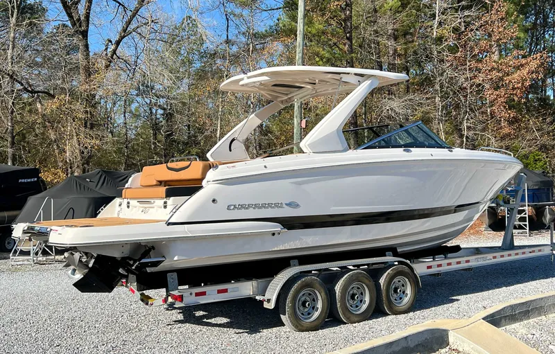 Slide: The Image of 2024 Chaparral 307 SSX boat on trailer outdoors. - 7