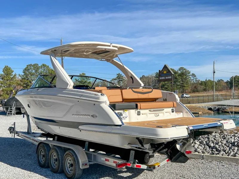 Slide: The Image of 2024 Chaparral 307 SSX boat on trailer outdoors. - 9
