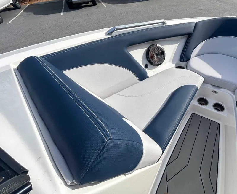 Slide: The Image of Interior of a 2020 MasterCraft XT23 boat with blue and white seating. - 11