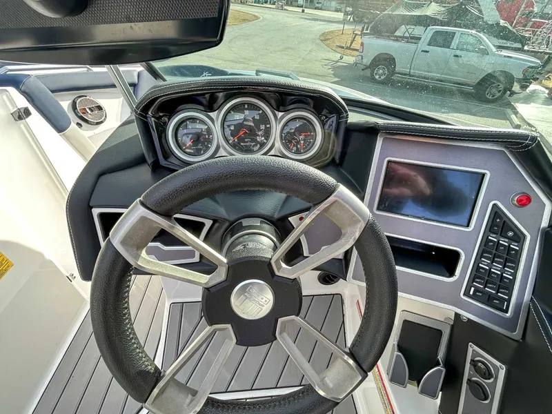 Slide: The Image of Interior view of 2020 MasterCraft XT23 boat cockpit. - 16