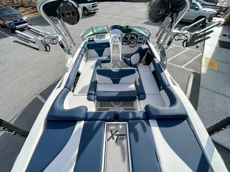 Slide: The Image of Interior view of a 2020 MasterCraft XT23 boat with luxurious seating. - 8