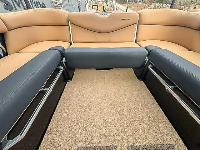 Slide: The Image of Interior of a 2018 MasterCraft XT22 boat with beige and black seating. - 18