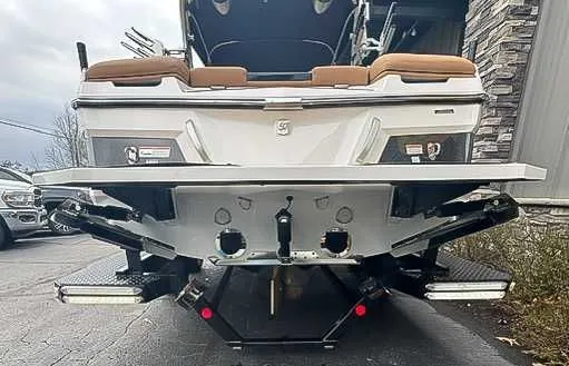 Slide: The Image of Rear view of a 2018 MasterCraft XT22 boat on a trailer. - 8