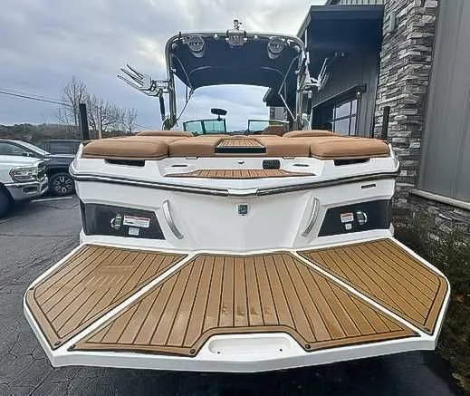 Slide: The Image of Rear view of a 2018 MasterCraft XT22 boat with wooden deck. - 9