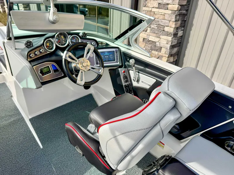 Slide: The Image of Interior of a 2017 MasterCraft XT21 boat with modern dashboard. - 15