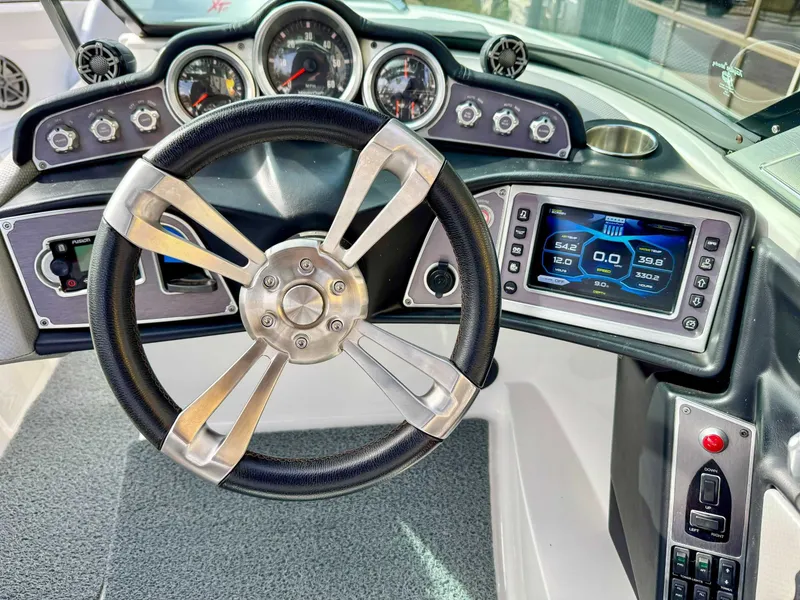 Slide: The Image of 2017 MasterCraft XT21 boat steering console with dashboard. - 16