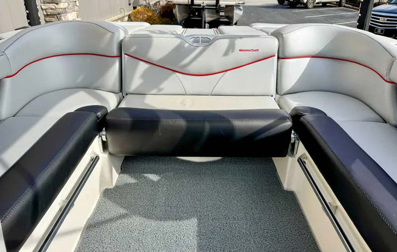 Slide: The Image of Interior of a 2017 MasterCraft XT21 boat with gray and black seating. - 19