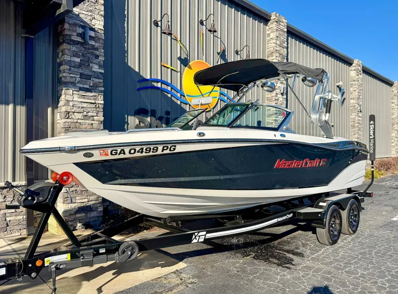 Slide: The Image of 2017 MasterCraft XT21 boat parked in front of a building. - 3