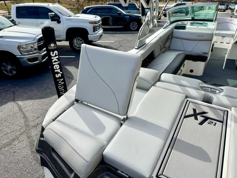 Slide: The Image of 2017 MasterCraft XT21 boat with luxurious interior seating. - 9