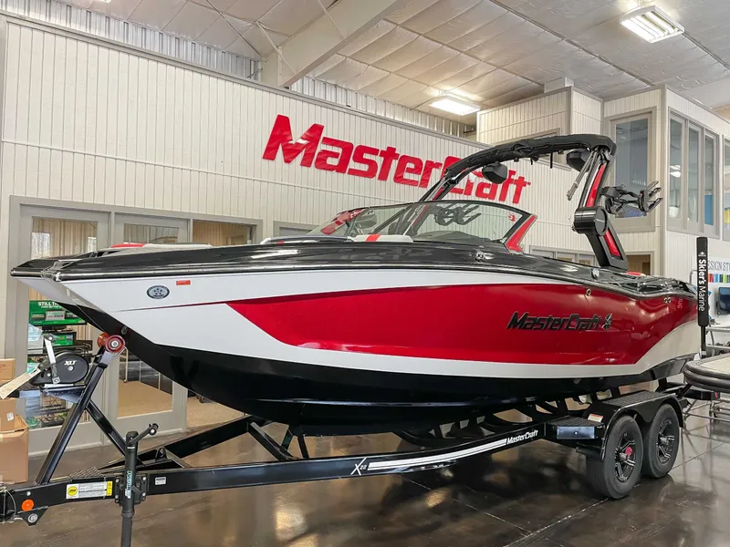 The Image of 2022 MasterCraft X22 boat in red and white finish. - 1
