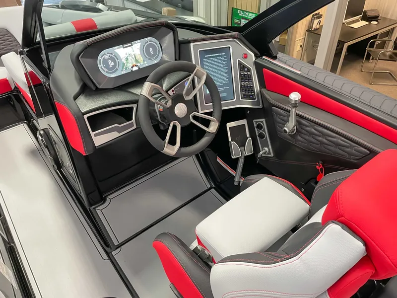 Slide: The Image of Interior of a 2022 MasterCraft X22 boat with modern dashboard. - 16