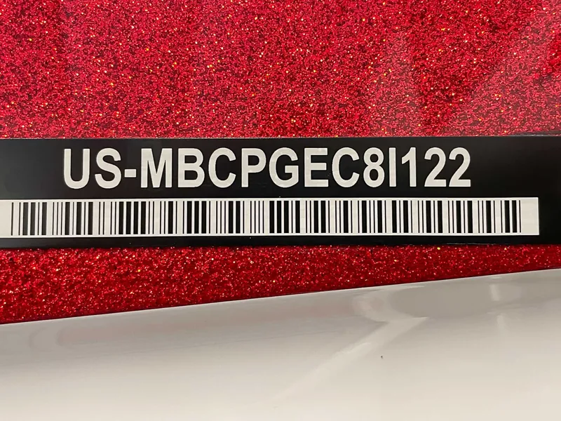 Slide: The Image of MasterCraft X22 2022 serial number on red background. - 22