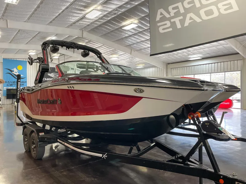 Slide: The Image of 2022 MasterCraft X22 boat in a showroom. - 4