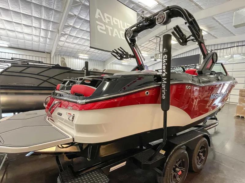 Slide: The Image of 2022 MasterCraft X22 boat in a showroom. - 6