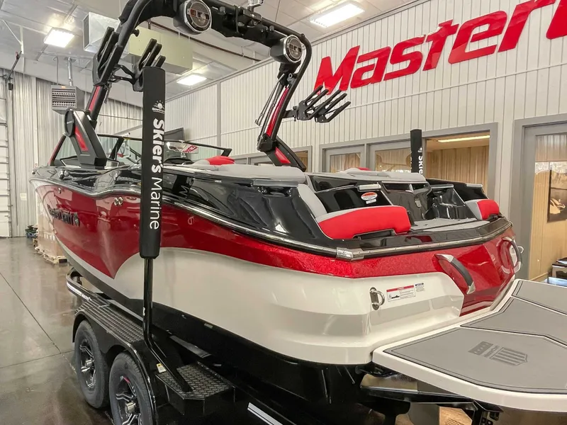 Slide: The Image of 2022 MasterCraft X22 boat in a showroom. - 7