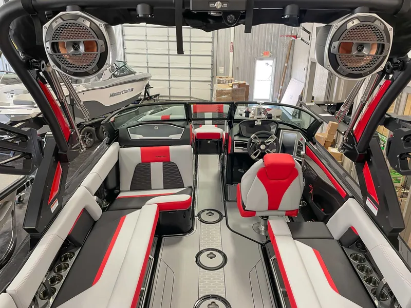 Slide: The Image of Interior of a 2022 MasterCraft X22 boat with red and gray seating. - 9