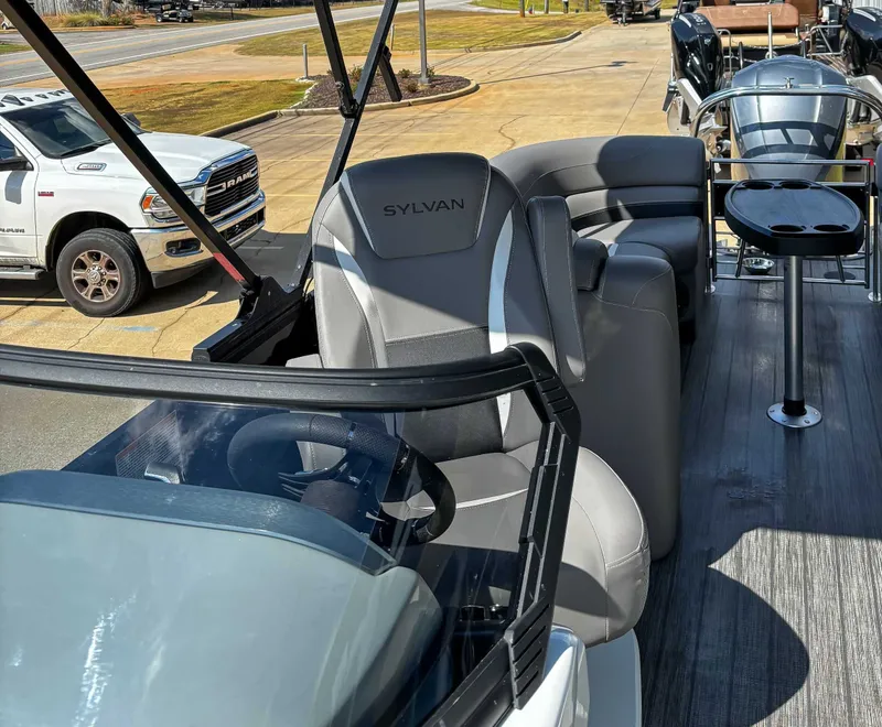 Slide: The Image of Sylvan S5 LZ DC 2021 pontoon boat with gray seats and steering wheel. - 10