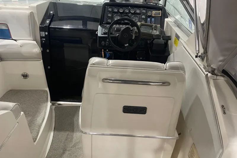 Slide: The Image of 1992 Chaparral Signature 30 boat interior with steering wheel and control panel. - 12