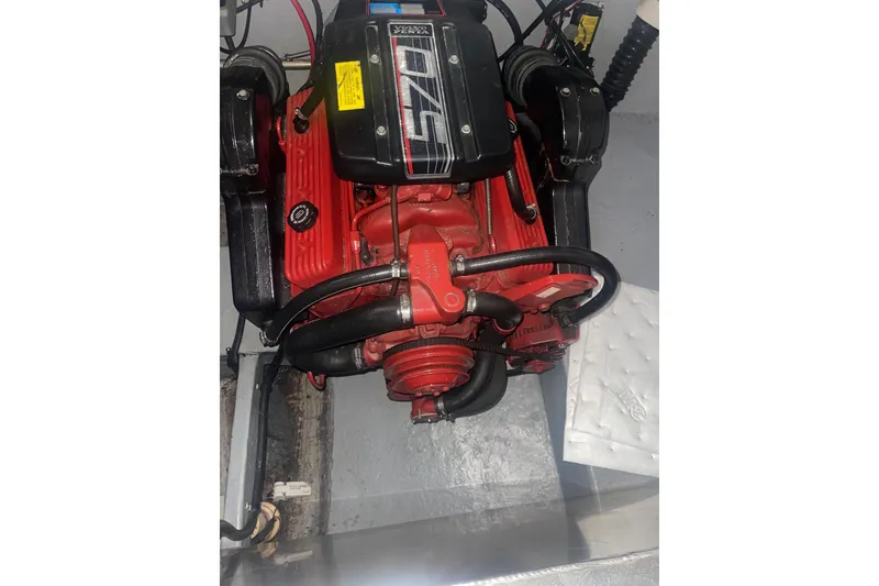 Slide: The Image of Engine of 1992 Chaparral Signature 30 boat, featuring red and black components. - 16