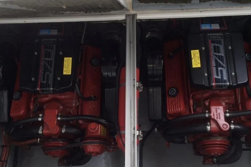 Slide: The Image of Twin engines of a 1992 Chaparral Signature 30 boat, showcasing detailed mechanical components. - 17