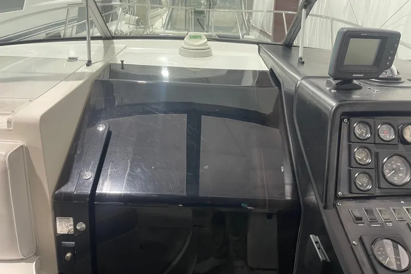 Slide: The Image of 1992 Chaparral Signature 30 boat dashboard with gauges and navigation equipment. - 18