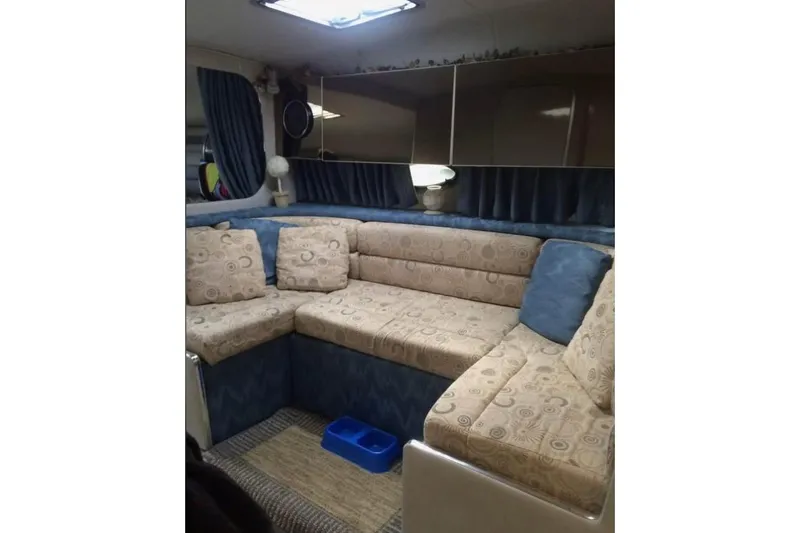 Slide: The Image of 1992 Chaparral Signature 30 interior with patterned seating and blue accents. - 20