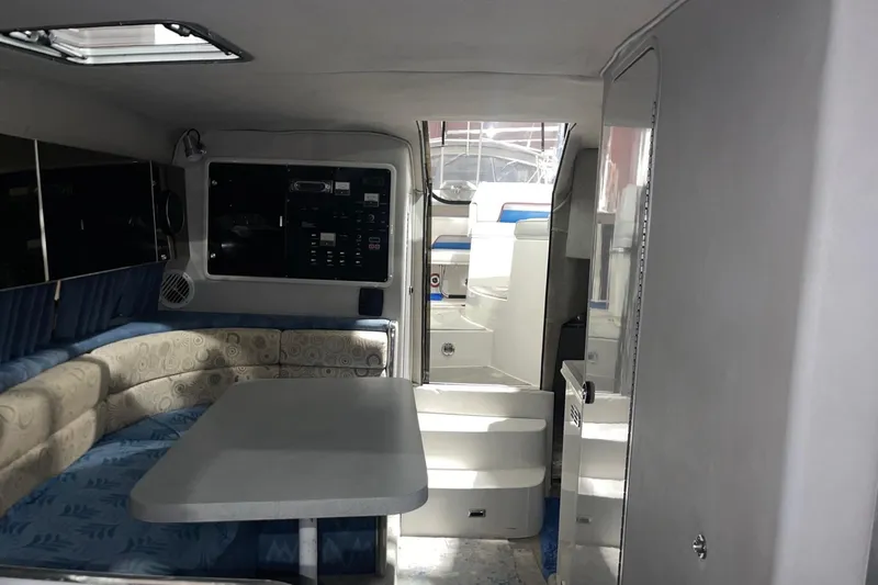Slide: The Image of Interior of 1992 Chaparral Signature 30 boat with seating and control panel. - 30