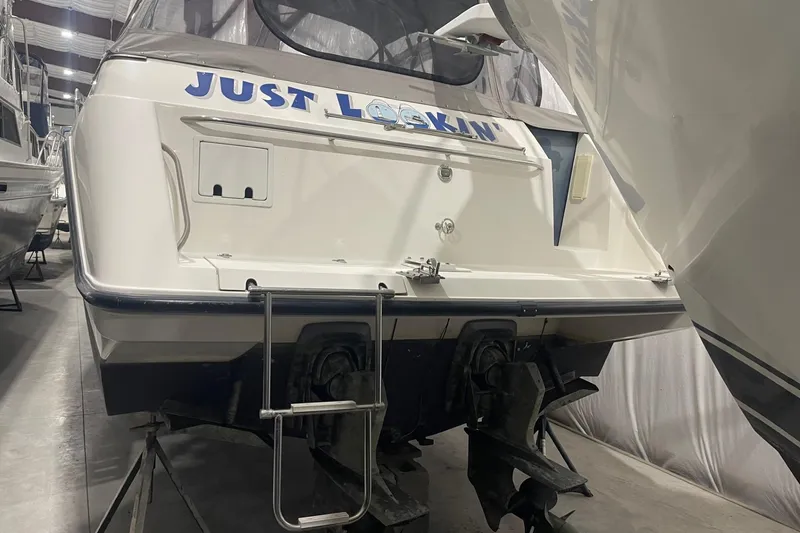 Slide: The Image of 1992 Chaparral Signature 30 boat in storage, rear view with ladder. - 4