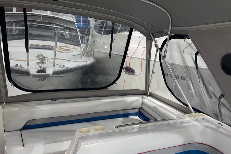 Slide: The Image of 1992 Chaparral Signature 30 boat interior with seating and window view. - 6