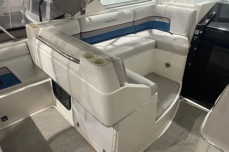 Slide: The Image of 1992 Chaparral Signature 30 boat interior with white seating and blue accents. - 8