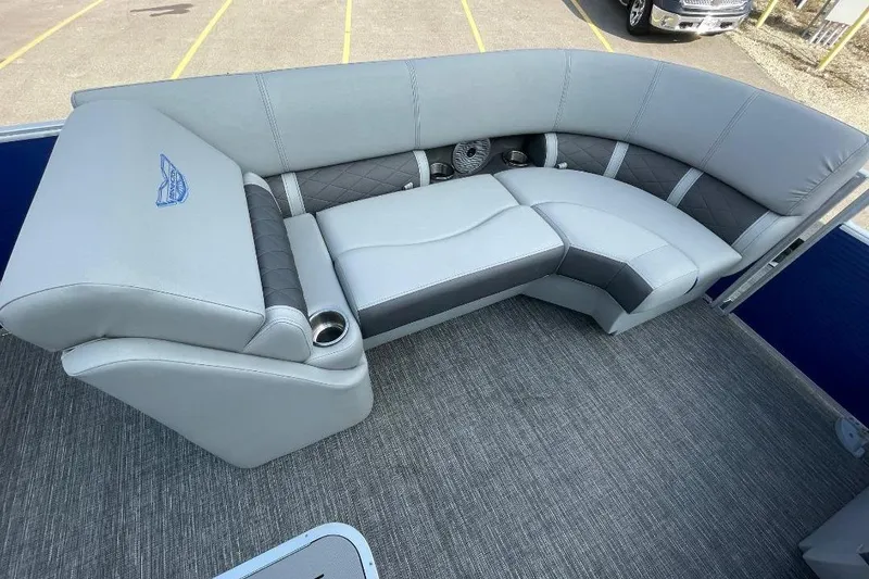 Slide: The Image of 2024 Bennington 23 LSB boat interior with luxurious gray seating and cup holders. - 10