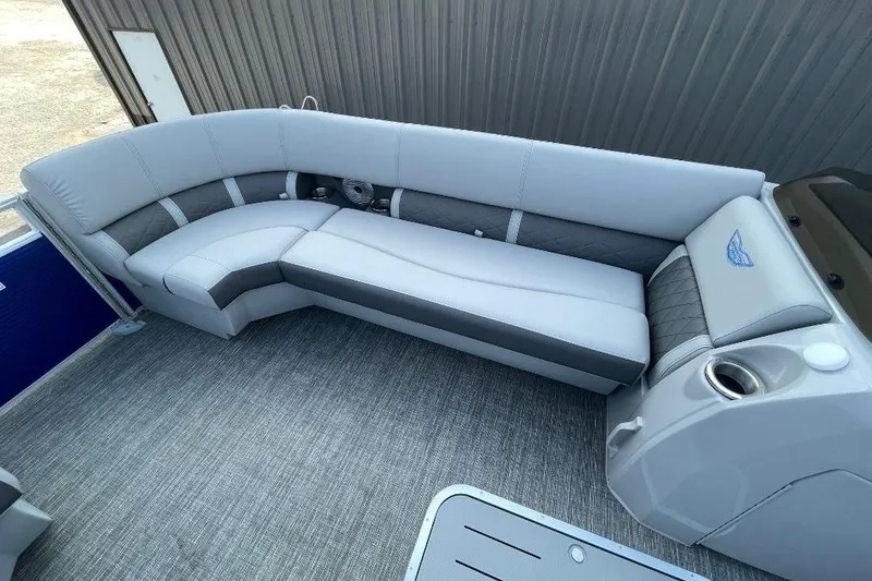 Slide: The Image of 2024 Bennington 23 LSB pontoon boat interior with luxurious seating and modern design. - 9