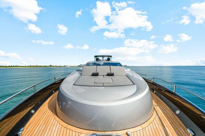 Slide: The Image of Luxurious 2010 Sunseeker Predator 84 yacht on serene blue waters under a clear sky. - 23