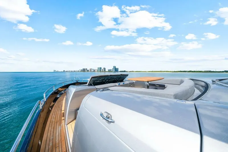 Slide: The Image of Luxurious 2010 Sunseeker Predator 84 yacht cruising on a sunny day with city skyline view. - 26