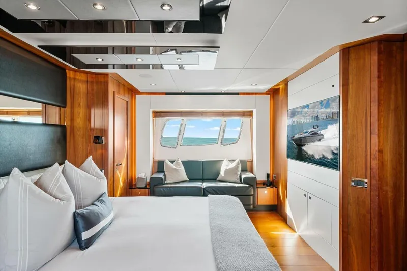 Slide: The Image of Luxurious Sunseeker Predator 84 yacht interior, 2010 model, featuring elegant wood finishes and ocean view. - 50