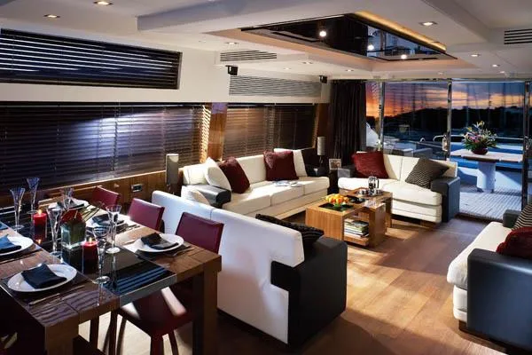 Slide: The Image of Luxurious 2010 Sunseeker Predator 84 yacht on serene blue waters under a cloudy sky. - 9