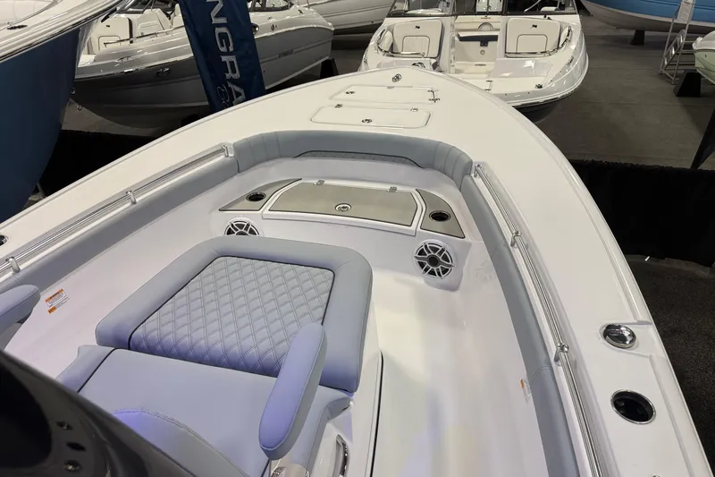 Slide: The Image of 2026 Sportsman Masters 267OE Bay Boat interior with seating and storage compartments. - 1
