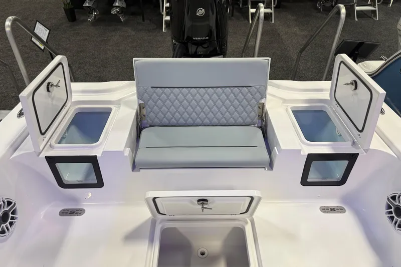 Slide: The Image of 2026 Sportsman Masters 267OE Bay Boat interior with seating and storage compartments. - 10