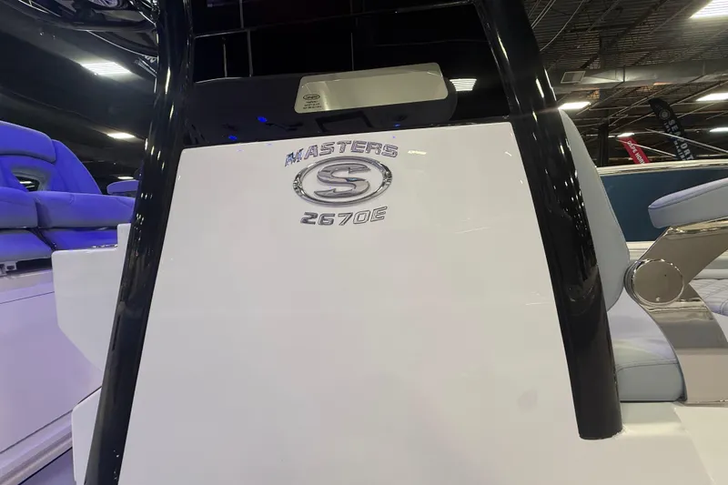Slide: The Image of 2026 Sportsman Masters 267OE Bay Boat interior with logo detail. - 11
