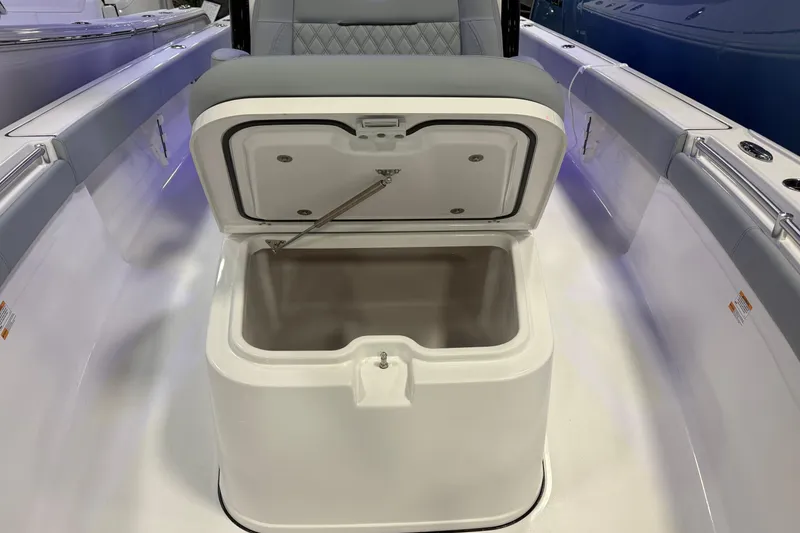 Slide: The Image of Open storage compartment on 2026 Sportsman Masters 267OE Bay Boat, showcasing interior space. - 3