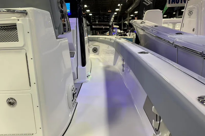 Slide: The Image of 2026 Sportsman Masters 267OE Bay Boat interior at a boat show, showcasing sleek design. - 6