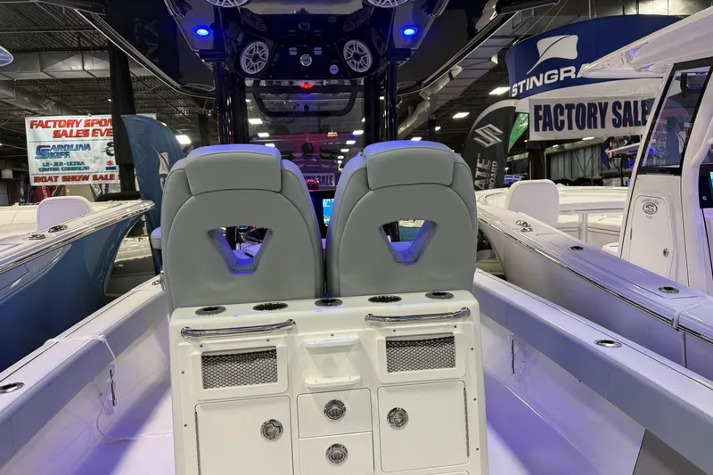 Slide: The Image of 2026 Sportsman Masters 267OE Bay Boat interior at a boat show event. - 7