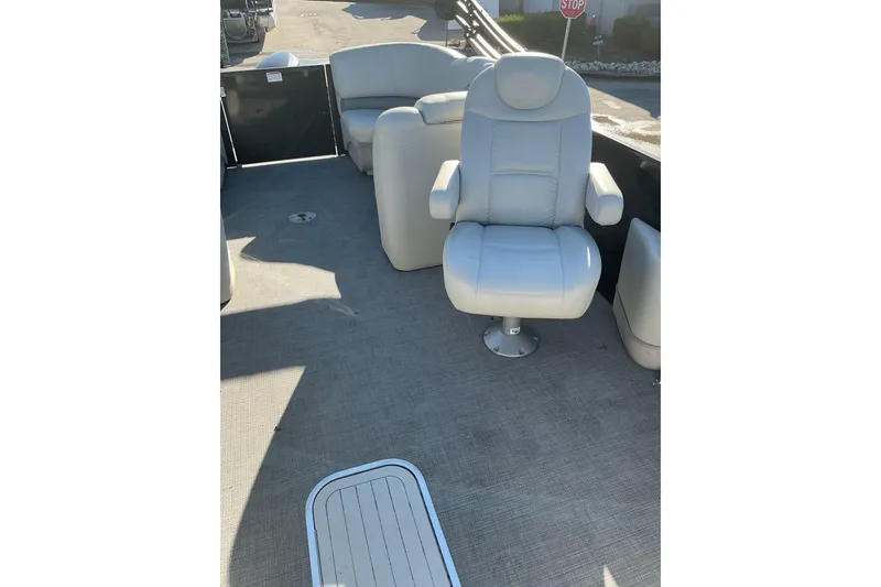 Slide: The Image of 2016 Starcraft SLS 3 boat interior with plush seating and carpeted flooring. - 11