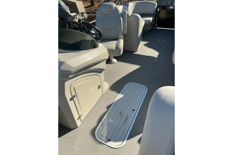 Slide: The Image of 2016 Starcraft SLS 3 boat interior with beige seating and helm. - 13