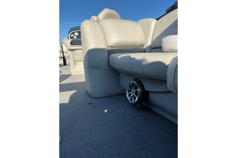 Slide: The Image of 2016 Starcraft SLS 3 boat interior with beige seating and speaker detail. - 14